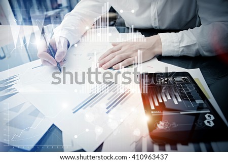 Investment manager working process.Concept photo trader work market report modern tablet.Using electronic device.Graphic icons,stock exchange reports screen interfaces.Business startup.Film effect