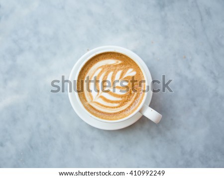 Cup of Coffee on Marble Table Royalty-Free Stock Photo #410992249