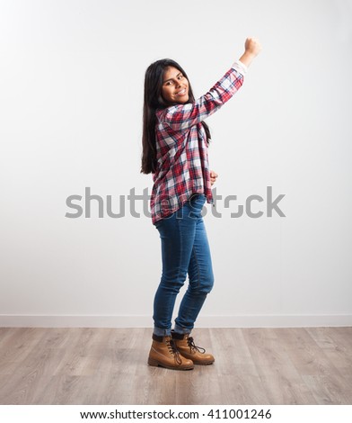 latin girl doing winner gesture