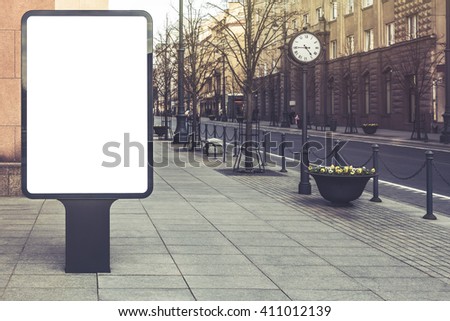 Blank mockup of  vertical advertising street billboard on city background. Vintage effect filter style
