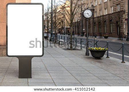 Blank mockup of vertical advertising street billboard on city background