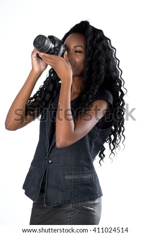 Woman looking at digital camera on white background