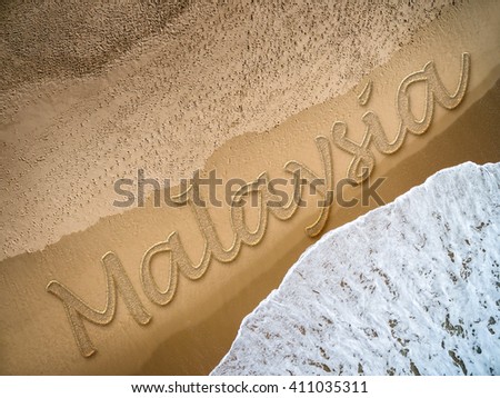 Malaysia written on the beach