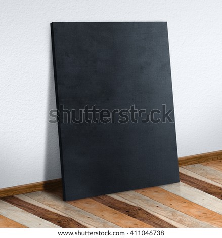 Blank black fabric canvas on white wall and wooden floor,Mock up to display or montage of your content.