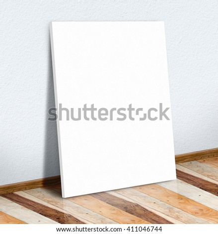 Blank white paper poster on white wall and wooden floor,Mock up to display or montage of your content.