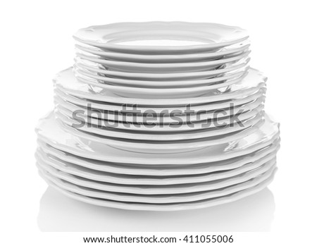 Stacked white dishes isolated on white