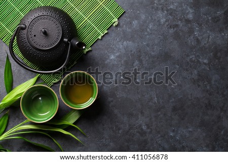 Green japanese tea on stone table. Top view with copy space Royalty-Free Stock Photo #411056878