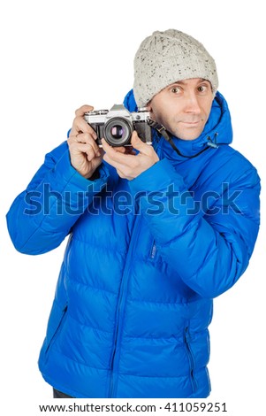 young man taking photo by film vintage camera