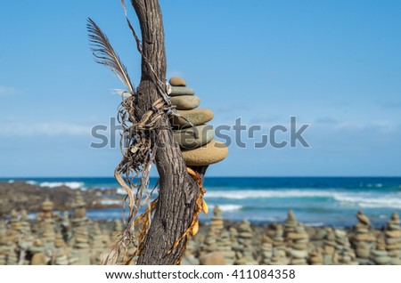Stacked rocks cover the beach at Carisbrook Creek on the Great Ocean Road in Victoria, Australia.