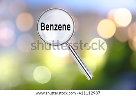 Magnifying lens over background with text Benzene, with the blurred lights visible in the background. 3D rendering.