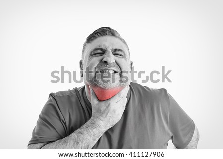 45 year old man with sore throat, hand on throat, isolated on white. Negative human emotion, facial expressions, feelings. Black & White picture.