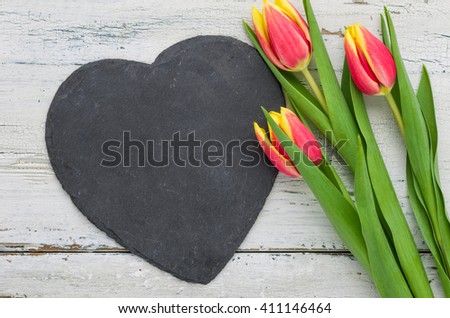  Red Tulips on a white background with a heart-shaped sign