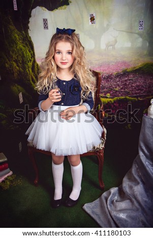 Beautiful girl as Alice in Wonderland