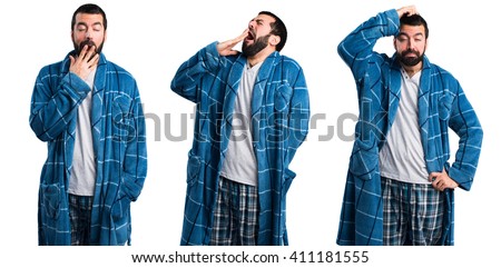Man in dressing gown yawning Royalty-Free Stock Photo #411181555