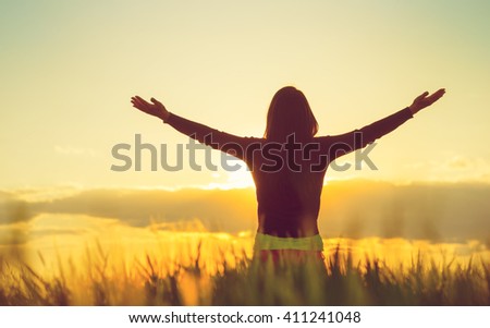 Woman feeling free in a beautiful natural setting. Royalty-Free Stock Photo #411241048