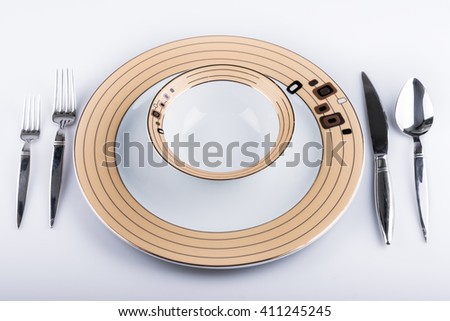 Empty Plate, Fork and Knife Isolated on White background