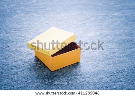 Cardboard package container for a present, colorful gift boxes, Concept of celebration, birthday or event. Simple and clean packaging picture to be used as blank dummy or background.