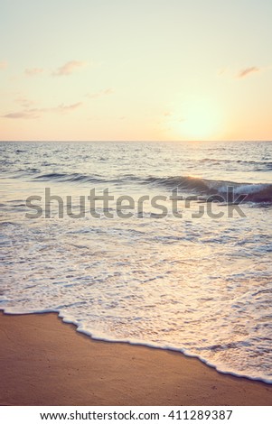 Beautiful Sunset with sea and beach - Vintage and sunflare filter effect