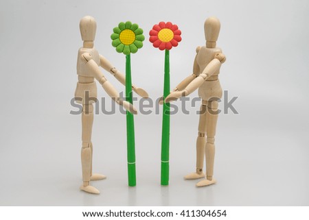 concept of we love nature by man Wood Figure ,women Wood Figure and child wood figure ./white background