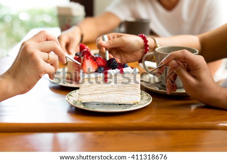 Happy family enjoy eating cake in the restaurant. indoor Royalty-Free Stock Photo #411318676