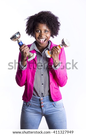Young African girl with cup of victory