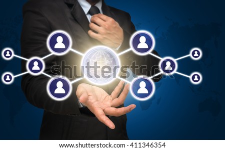 Businessman with show hand posture with the Social media symbol on blue color background with world map,Elements of this image furnished by NASA, Business network concept