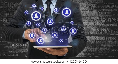 Businessman using the tablet for social connection on business text background,Business network concept