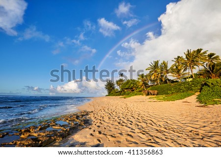 rainbow scenic view over the popular surfing place Sunset Beach, North Shore, Oahu, Hawaii, USA Royalty-Free Stock Photo #411356863