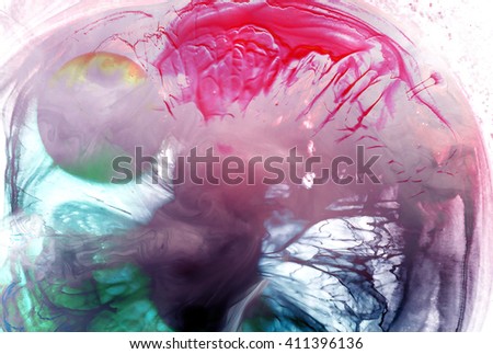 Color ink in the water on a light background