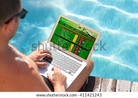 Man using sports betting website by the pool