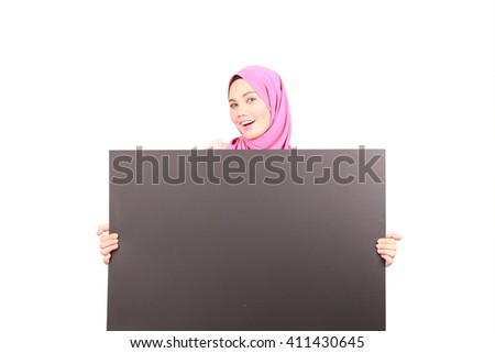 Cute woman pointing blank white board