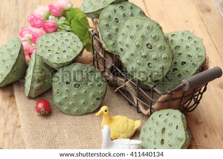 Lotus seeds in nature on wood background