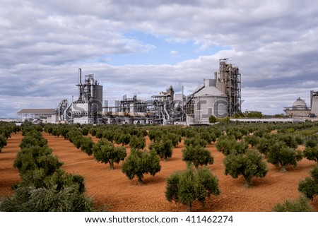 Cement factory, on a field of olive trees
