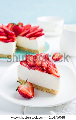 no baked strawberry cheesecake on white background, selective focus Royalty-Free Stock Photo #411475048