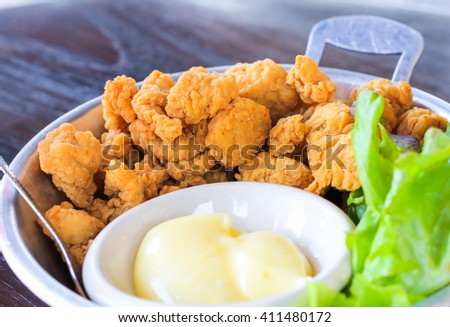 Chicken fry pop with mayonnaise in the pan Royalty-Free Stock Photo #411480172