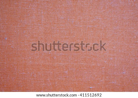 Natural linen colored orange canvas fabric background