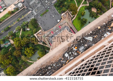 View of the Eiffel Tower approaches with little trash on the top