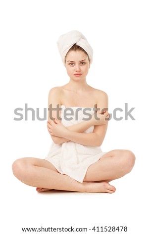 Pretty woman in towel after spa  Isolated on a White Background.