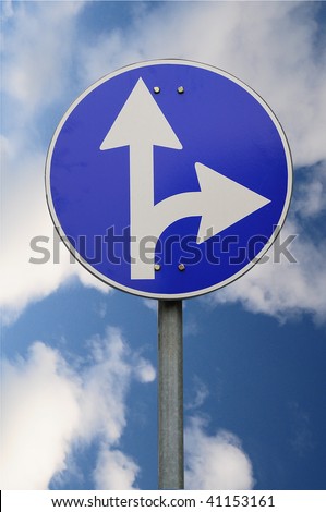 Directions sign on sky background