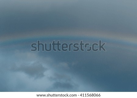 Blue sky and rainbow photo at evening.