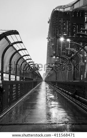 Black and white picture of Sydney Harbour Bridge in the rain