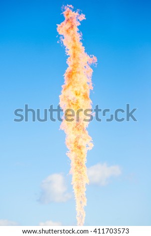 gas flame over blue sky background