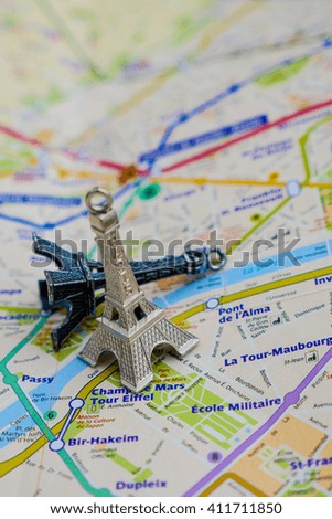 Paris name at a map with red Eiffel tower miniature Travel Destination Paris