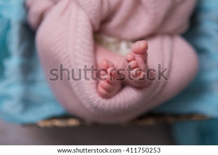 photo of feet of a newborn two weeks baby closeup