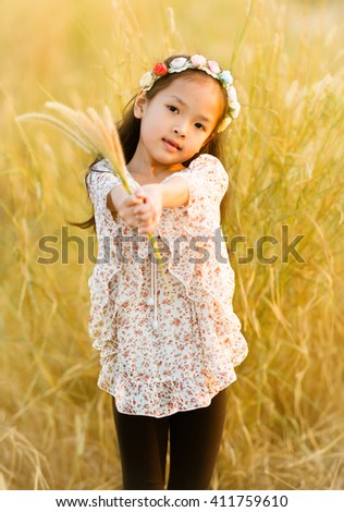 Little girl on meadow 