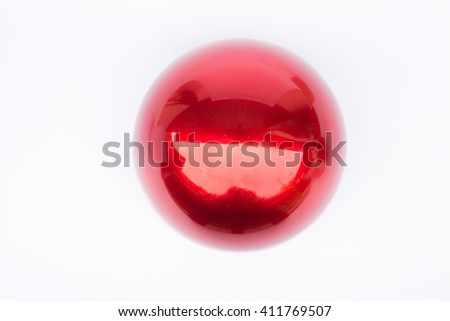 Shiny hard red ball on white background, stock photo