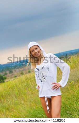 Beautiful young girl on the meadow