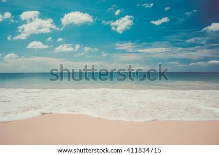 Beach with blue sky and white cloud. Travel concept. Retro color style.