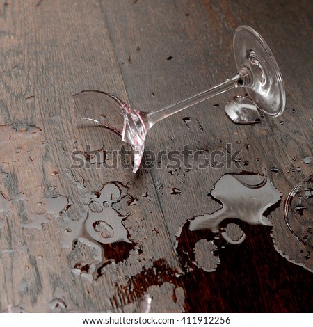 Broken wine glass Royalty-Free Stock Photo #411912256