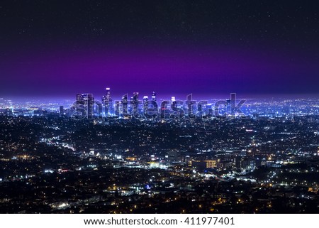 Aerial view of Los Angeles downtown city night skyline over the Hollywood at night. LA valley California cityscape night lights